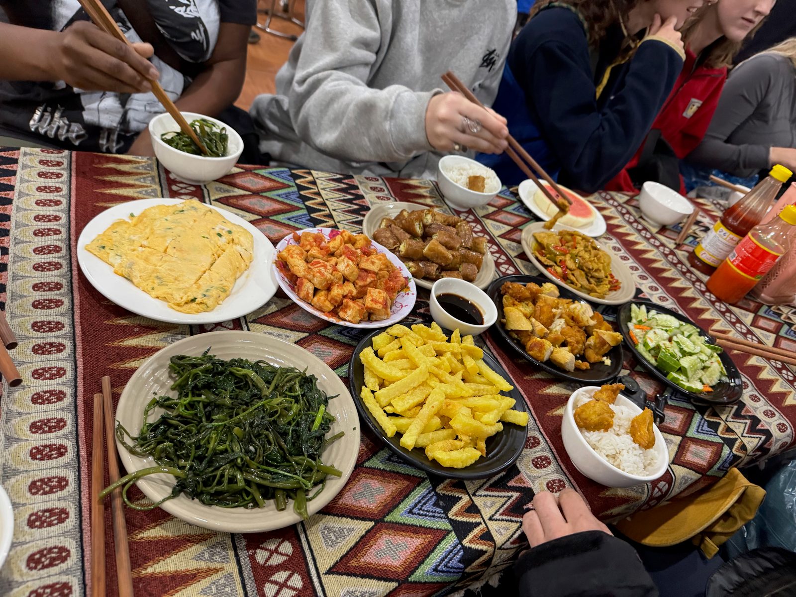 Communal dinner - dishes spread across the table