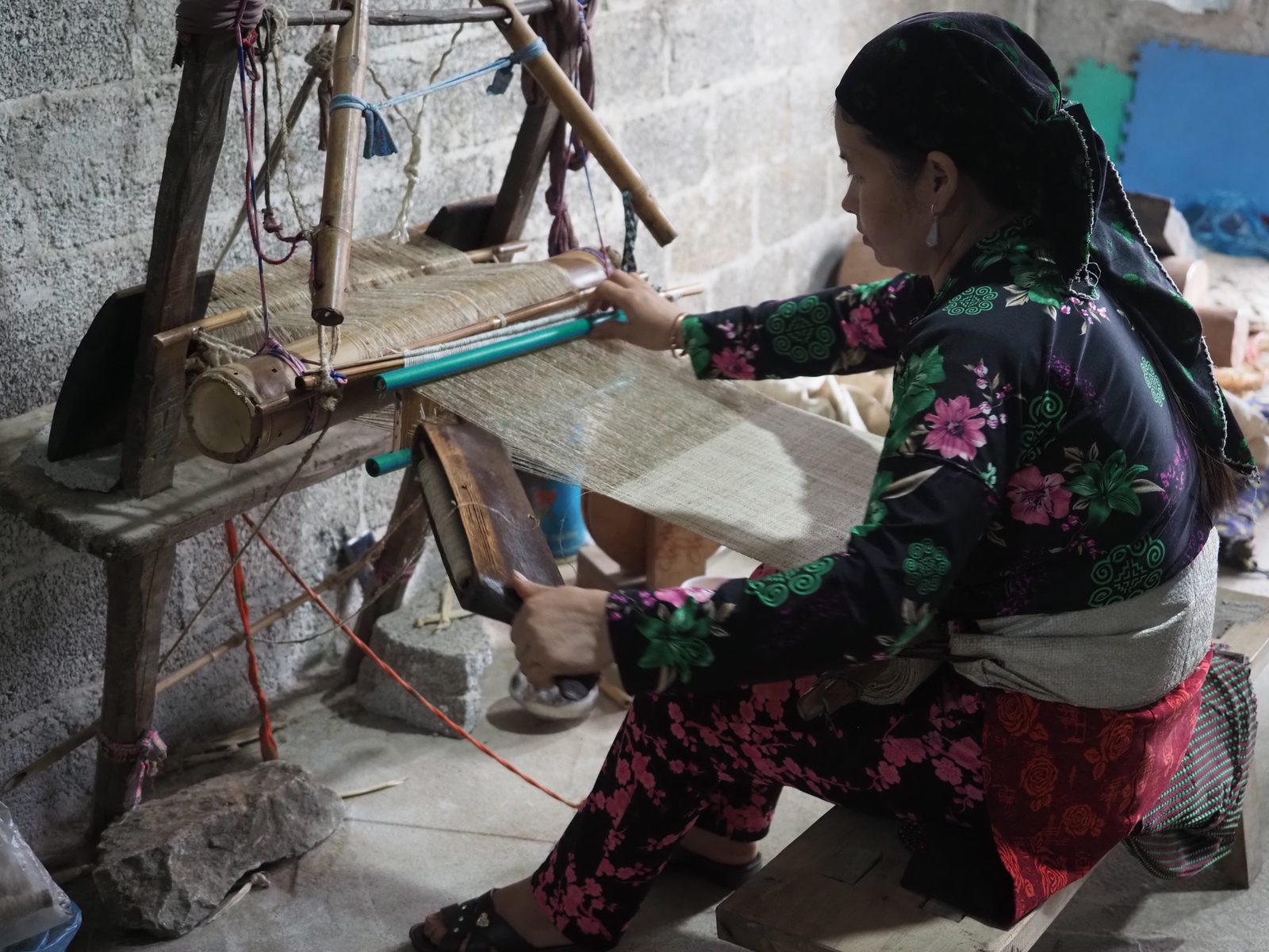 Woman weaving traditional textile in a Hà Giang village
